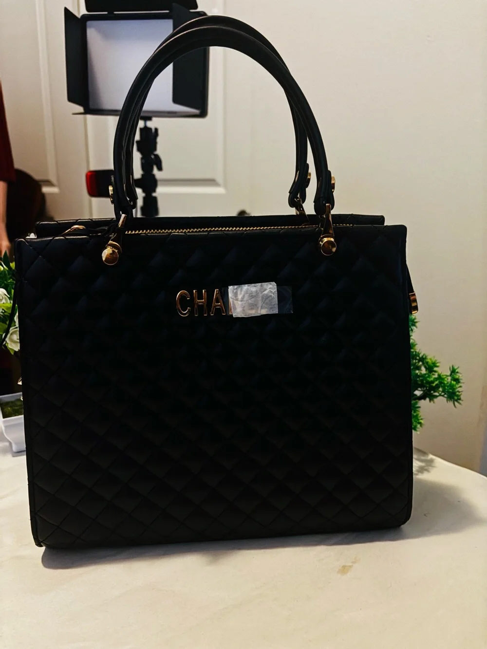 Black Quilted Top-Handle Tote with Gold Hardware